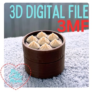 May include: A brown 3D-printed dim sum steamer with seven white dumplings. The text "3D DIGITAL FILE" in teal and "3MF" in red is displayed above the steamer. A heart-shaped graphic with text is in the lower left corner.