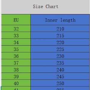 May include: A size chart with EU shoe sizes and corresponding inner lengths in millimeters. The chart is divided into green and blue columns, with sizes ranging from EU 32 to 41. The text "Size Chart" is at the top.
