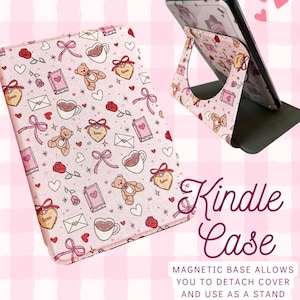 May include: Pink Kindle case with a repeating pattern of teddy bears, hearts, roses, bows, and coffee cups. The case is shown open, with a phone propped up in the stand. The text "Kindle Case" is displayed in a cursive font.