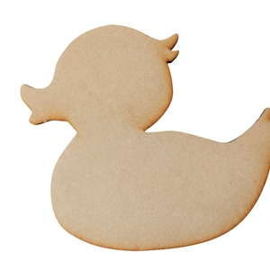 May include: A wooden duck-shaped cutout, suitable for craft projects. The duck is light brown with a smooth surface and rounded edges. It features a head, beak, body, and tail, all in a simple, clean design. Ideal for DIY enthusiasts.