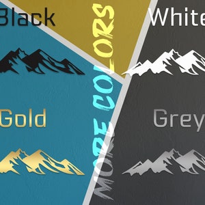 May include: Four mountain range silhouette decals in different colors: black, white, gold, and grey. The decals are displayed on a background of four different colors: blue, gold, grey, and black.