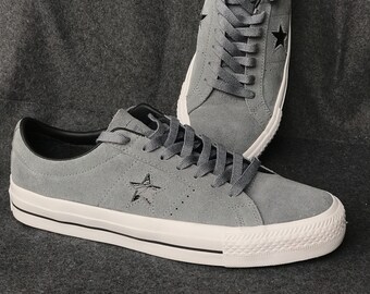 black suede converse high tops