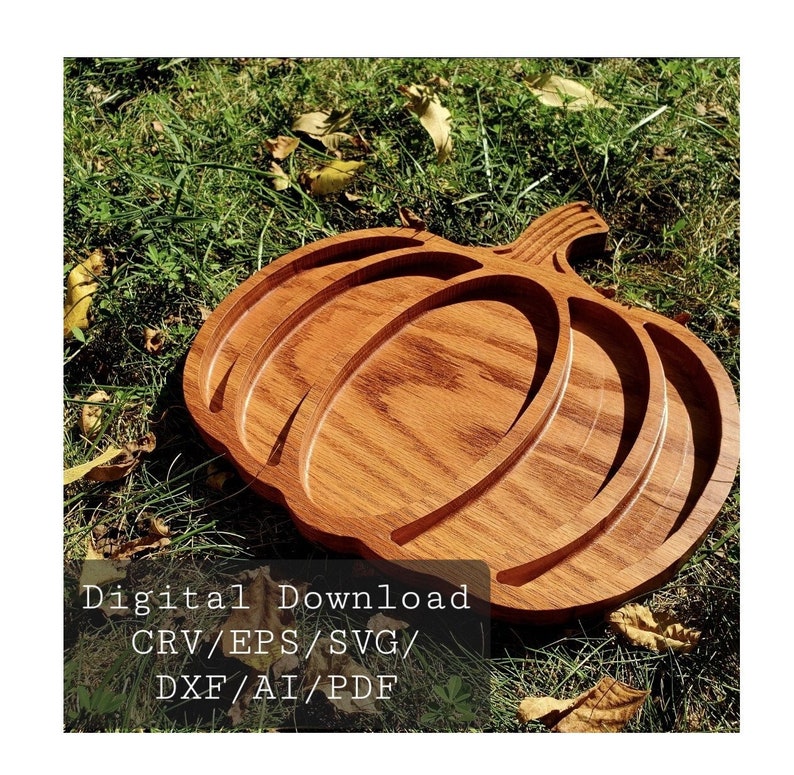 May include: A wooden pumpkin-shaped serving tray with three indented sections. The tray is made of light brown wood with a natural grain pattern. The text "Digital Download CRV/EPS/SVG/DXF/AI/PDF" is visible in the lower left corner of the image.