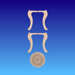May include: Two unfinished wooden table legs with a decorative mandala-style round tabletop.