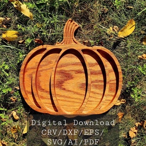 May include: A wooden pumpkin-shaped serving tray with three sections. The tray is made of light brown wood with a grain pattern. The text "Digital Download CRV/DXF/EPS/SVG/AI/PDF" is printed on a white background below the tray.