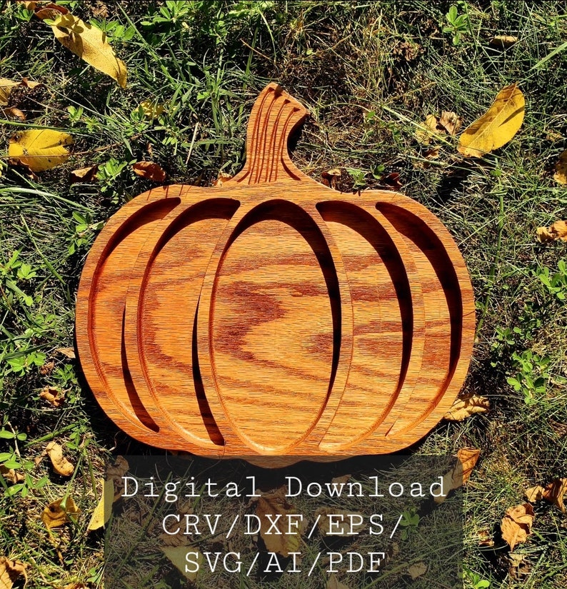 May include: A wooden pumpkin-shaped serving tray with three sections. The tray is made of light brown wood with a grain pattern. The text "Digital Download CRV/DXF/EPS/SVG/AI/PDF" is printed on a white background below the tray.