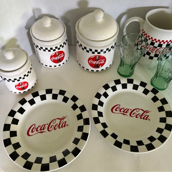 Coca Cola Vintage 1996 Dinnerware, Flat Rimmed Bowls, Dinner Plates, Canisters, Flatware, Glasses priced by the piece.