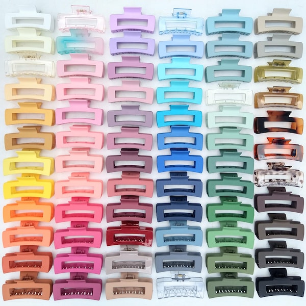 May include: A collection of rectangular hair claw clips arranged in a grid. The clips feature a variety of solid matte, translucent, and tortoiseshell finishes in a wide spectrum of colours including white, pink, blue, green, brown, and black.