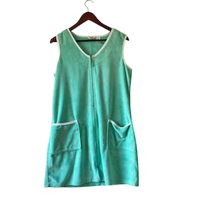 May include: A set of three ceramic mugs with a speckled, matte finish. The mugs are in shades of cream, light gray, and dark gray. Each mug has a simple, minimalist design, perfect for coffee or tea.