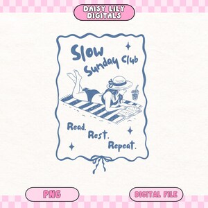 May include: A blue and white illustration of a woman reading on a beach towel, with the text "Slow Sunday Club. Read. Rest. Repeat." The image includes a straw hat, a drink, and a decorative border. The top of the image reads "DAISY LILY DIGITALS".