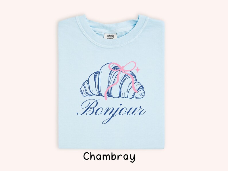 Light Blue T-Shirt with Pink Croissant Graphic, French Bonjour, Cute Casual Wear, Soft Cotton, Unisex