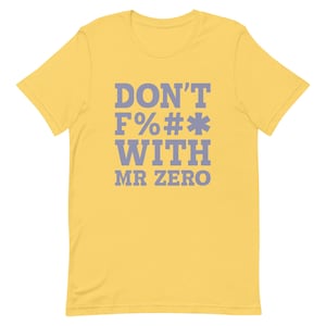 May include: Yellow t-shirt with the text "DON'T F%# WITH MR ZERO" in purple.