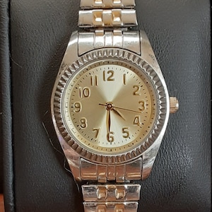 Reloj unisex elástico de metal bicolor