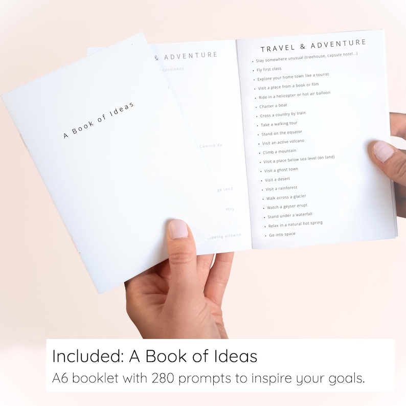 May include: A white A6 booklet titled A Book of Ideas with an open page showing a Travel & Adventure section. The list includes prompts like stay somewhere unusual, fly first class, explore your home town, and visit a ghost town.
