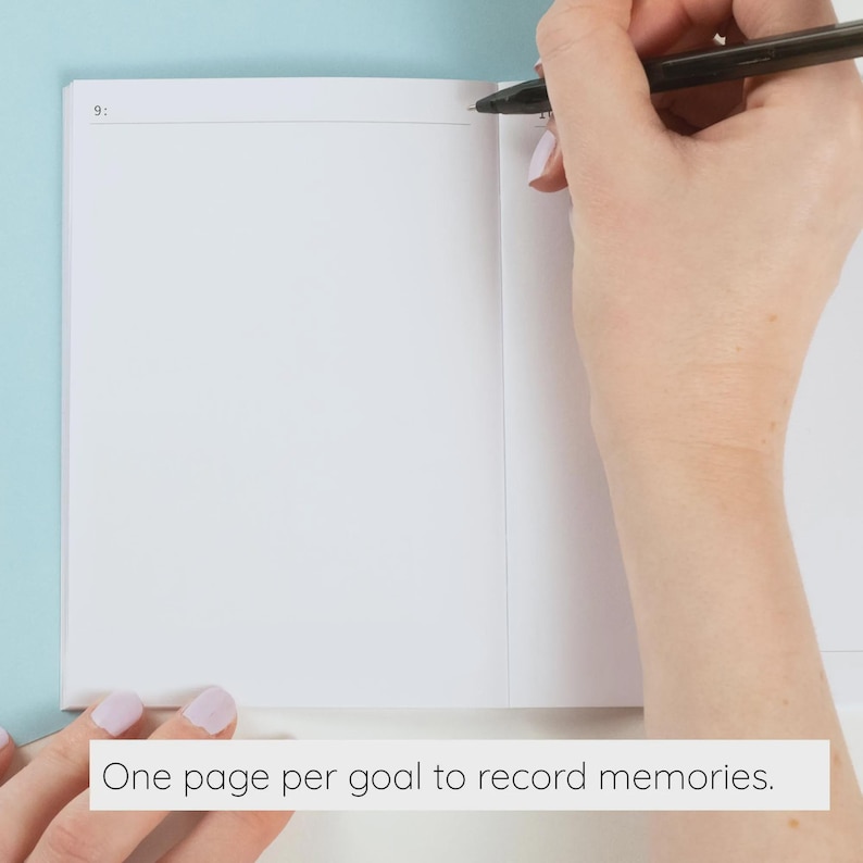 May include: An open white notebook with a black pen positioned on the top right corner of the page. The page features a thin horizontal line at the top with the number 9 printed on the left side. The notebook has blank white pages for writing.