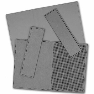 May include: A set of four grey felt pieces for crafting. The pieces are rectangular and have a dotted border. One piece has a grid pattern.