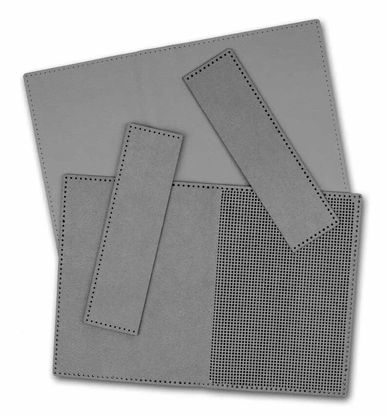 May include: A set of four grey felt pieces for crafting. The pieces are rectangular and have a dotted border. One piece has a grid pattern.