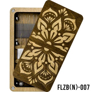 May include: A wooden box with a floral design on the lid. The box is open and contains a variety of sewing needles and thread. The box is labeled "FLZB(N)-007".