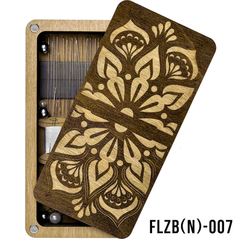 May include: A wooden box with a floral design on the lid. The box is open and contains a variety of sewing needles and thread. The box is labeled "FLZB(N)-007".