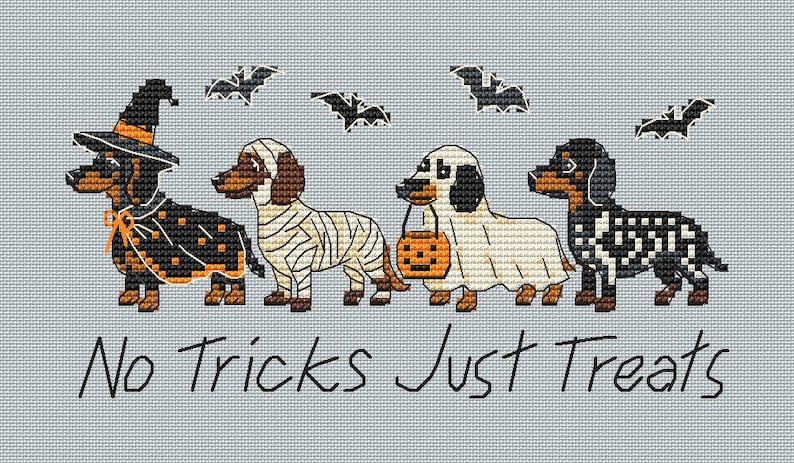 May include: A cross-stitch pattern on light blue fabric featuring four dachshunds in Halloween costumes: a witch, a mummy, a ghost holding a pumpkin bucket, and a skeleton. Above them are four black bats. The text reads: No Tricks Just Treats.
