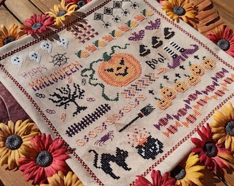 Korsstygnsmönster för halloween, enkelt broderimönster, räknat korsstygn med pumpa och häxa.