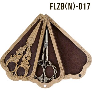 May include: A wooden box with a fan-shaped design, featuring intricate floral carvings. The box is open, revealing two pairs of silver-toned scissors with ornate handles. The box is labeled "FLZB(N)-017".
