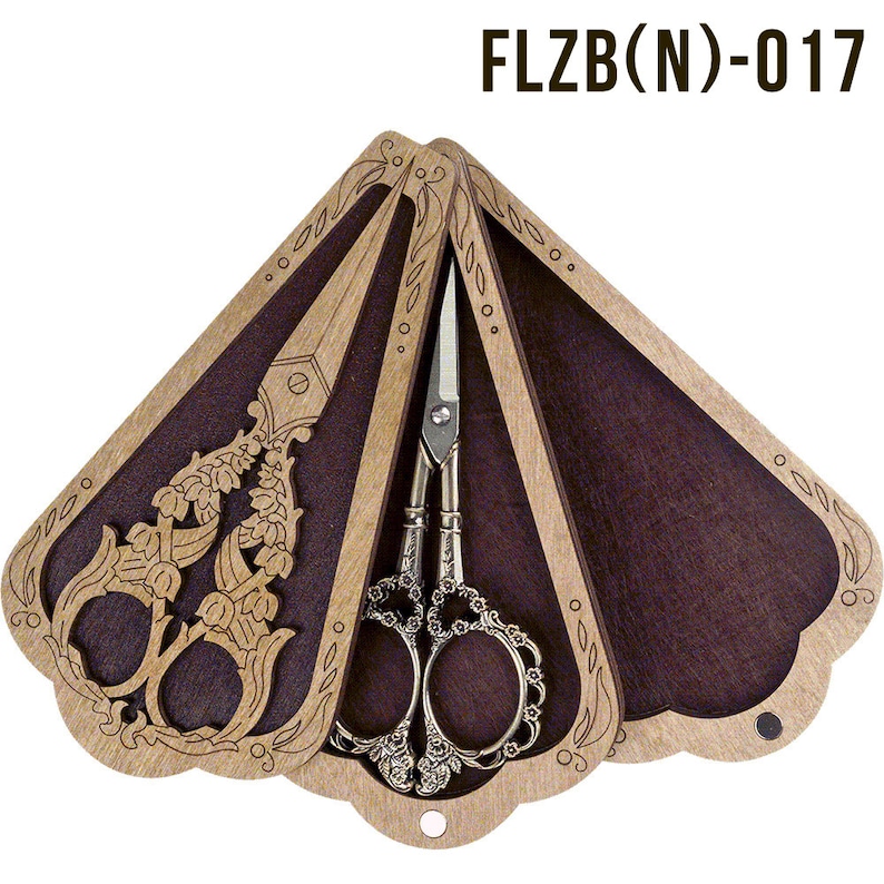 May include: A wooden box with a fan-shaped design, featuring intricate floral carvings. The box is open, revealing two pairs of silver-toned scissors with ornate handles. The box is labeled "FLZB(N)-017".