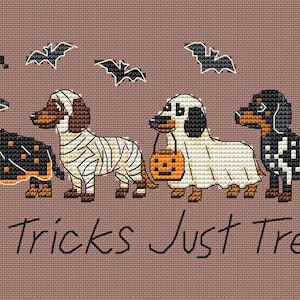 May include: A cross-stitch pattern on a brown background featuring four dachshunds in Halloween costumes: a witch, a mummy, a ghost holding an orange pumpkin bucket, and a skeleton. Four black bats fly above, with the text No Tricks Just Treats.