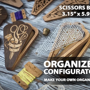 May include: Wooden scissors box with a laser-cut design, measuring 3.15" x 5.91". The box features a sewing-themed design and is part of an organizer configurator. Other wooden decorative elements and spools of thread are also visible.