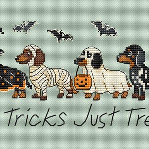 May include: A cross-stitch pattern on light green fabric featuring four dachshunds in Halloween costumes: a witch, a mummy, a ghost holding a pumpkin bucket, and a skeleton. Four black bats fly above, and the text reads No Tricks Just Treats.