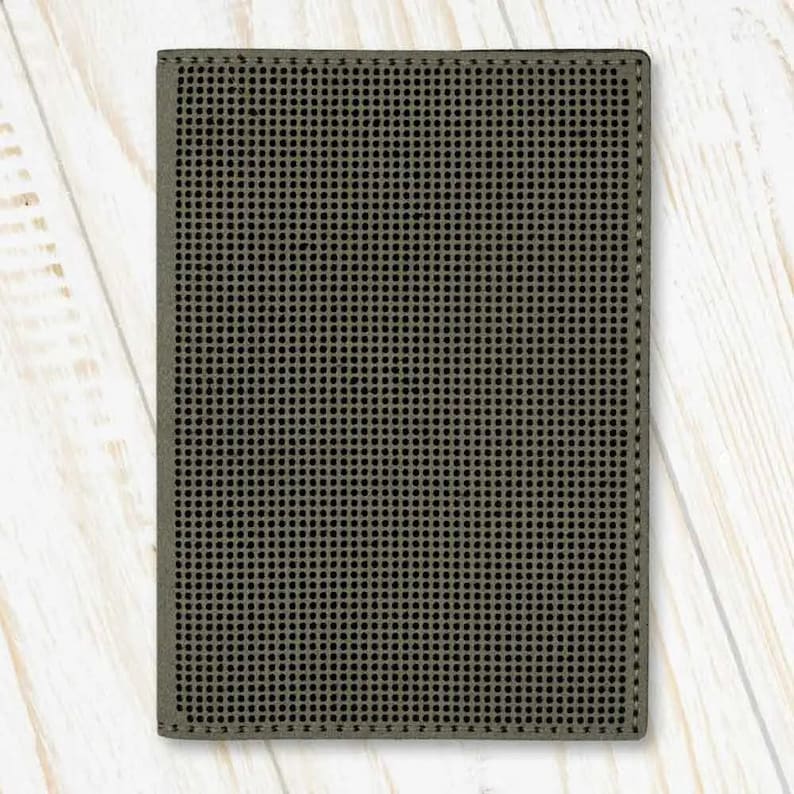May include: A dark grey, rectangular, textured, fabric wallet with a grid pattern.