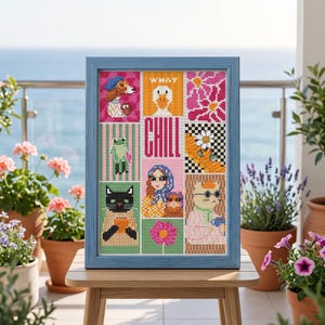 May include: A framed cross-stitch embroidery featuring a grid of colorful illustrations including a dog, a goose, a frog, a cat, and a person, with the text WHAT CHILL in the center. The artwork is encased in a light blue wooden frame.