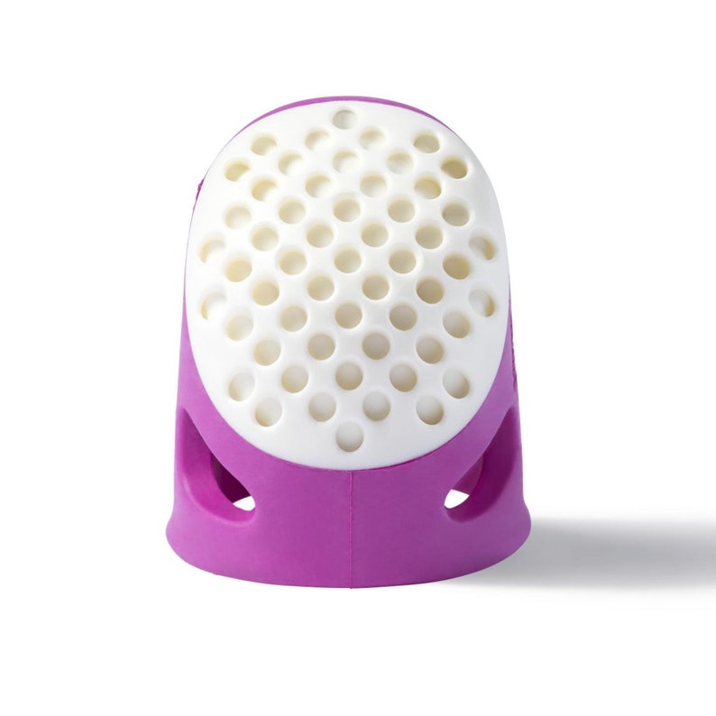 May include: Purple and white finger thimble with a perforated top and side openings.