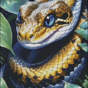 May include: A detailed illustration of a snake with a yellow, blue, and white pattern. The snake has bright blue eyes and is surrounded by green leaves. The artwork is a close-up, showcasing the snake's scales and texture.