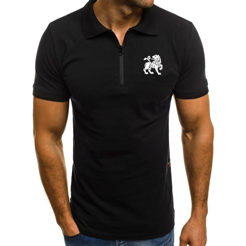 May include: A black short-sleeved polo shirt with a zip fastening and a white lion graphic on the chest.