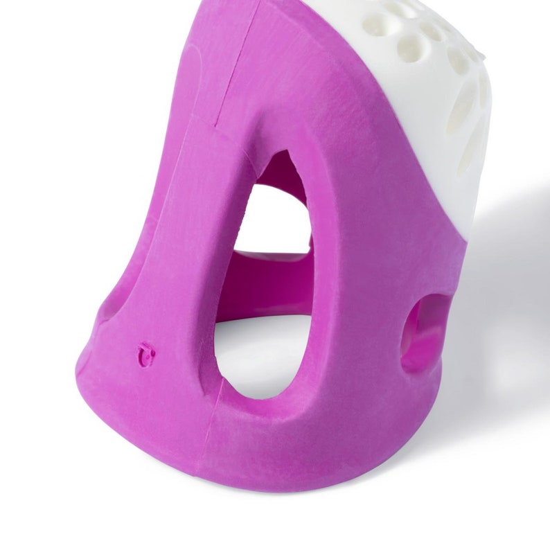 May include: A purple and white finger protector with a hole in the center. The protector is made of a soft, flexible material and is designed to help prevent finger injuries.