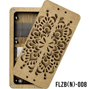 May include: A wooden box with a decorative cutout design on the lid. The box is open and reveals a variety of sewing supplies, including needles, thread, and beads. The box is labeled "FLZB(N)-008".
