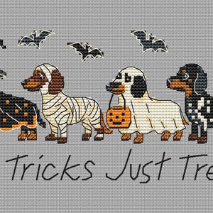 May include: A cross-stitch pattern on gray fabric featuring four dachshunds in Halloween costumes: a witch, a mummy, a ghost holding an orange pumpkin bucket, and a skeleton. Four black bats fly above, with the text No Tricks Just Treats below.