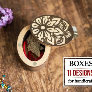 May include: A wooden box with a decorative lid featuring a floral design. The box is open and has a red string inside. The lid has a magnetic closure. The text "BOXES 11 DESIGNS! for handcraft" is visible in the image.
