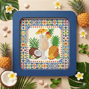 May include: A framed cross-stitch depicting a tropical cocktail, pineapple, and coconut. The artwork features a detailed border with a blue frame. The cocktail is garnished with a cherry and a tiny umbrella. The overall theme is a tropical vacation.