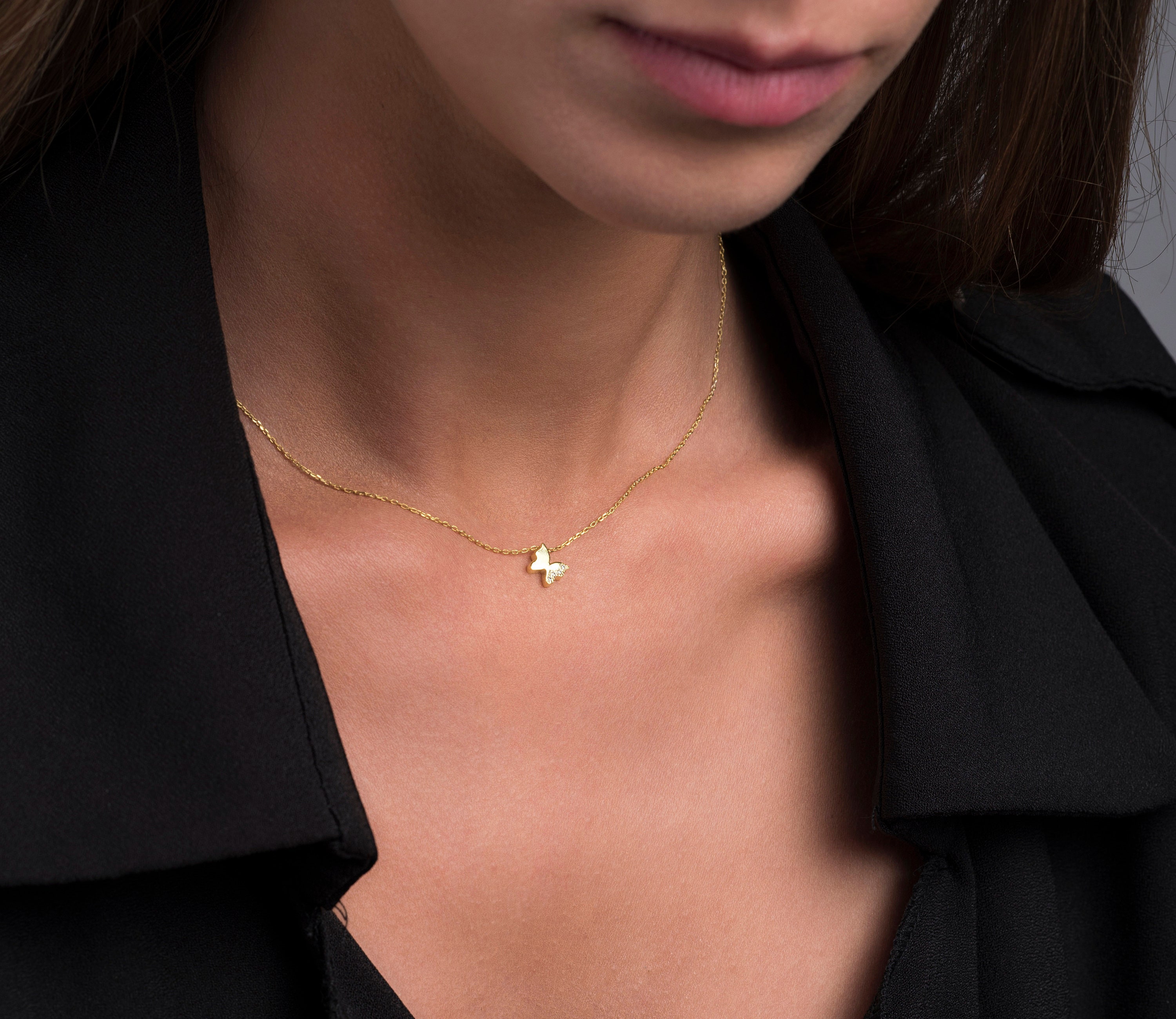 Tiny gold butterfly best sale necklace