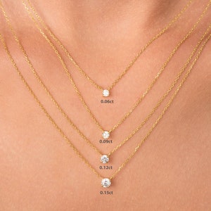 May include: Four gold necklaces with different sized diamond pendants. The pendants are 0.06ct, 0.09ct, 0.12ct, and 0.15ct.