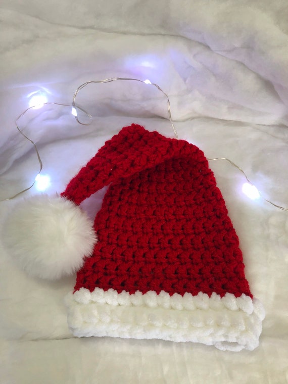 → View on Etsy: Handmade baby santa hat. Handmade baby santa hat.