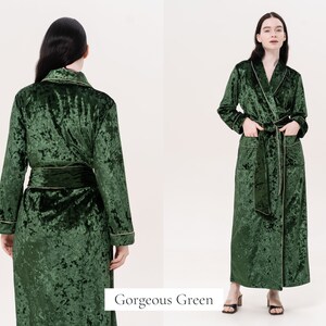 May include: A long, green velvet robe with gold trim. The robe has a shawl collar and a tie belt. The robe is shown from the front and back.