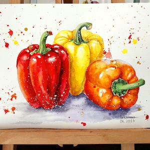 May include: Watercolor painting of three bell peppers, one red, one yellow, and one orange, on a white background with colorful splatters. The painting is signed "Pokamis 06.2023".