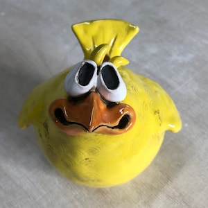 Ceramic sparrow looking funny