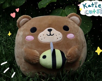 Winston the bear plushie (holding bee)