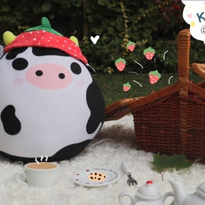 Kenny the cow with strawberry hat plushie