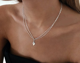 Collana a doppia catena con rombi in argento sterling e zirconi cubici