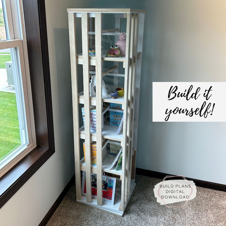 May include: White wooden bookshelf with six shelves, featuring a variety of books, decorative items, and a pineapple. The text "Build it yourself!" is written in black on a white background. The text "Build Plans Digital Download" is written in white on a black background.